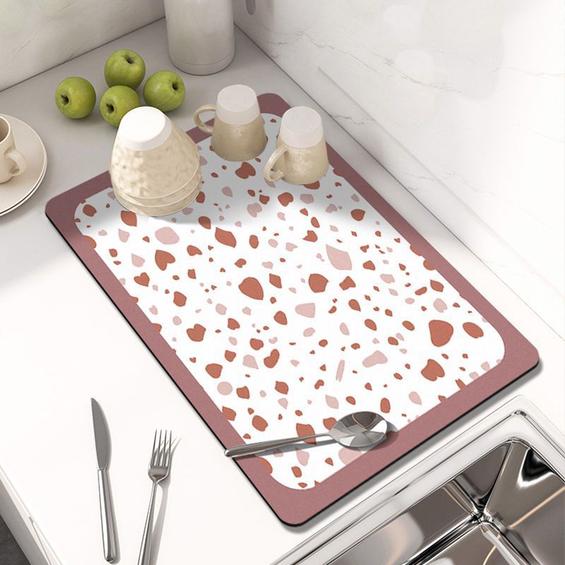 Showcasing Dish Drying Mat with spoon and mugs kept on a kitchen counter top 