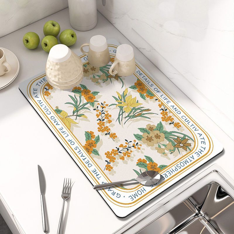 Showcasing Dish Drying Mat with spoon and mugs kept on a kitchen counter top