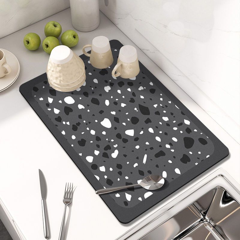 Showcasing Dish Drying Mat with spoon and mugs kept on a kitchen counter top