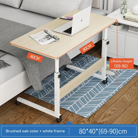 Showcasing and displaying the size of an Adjustable Movable Laptop Table placed beside to a bed in a room
