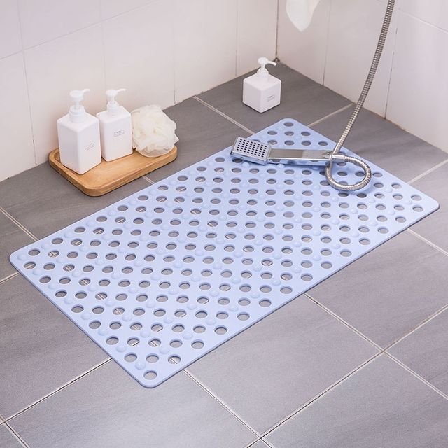 Non-slip extra-long bathroom shower mat placed in the bathroom