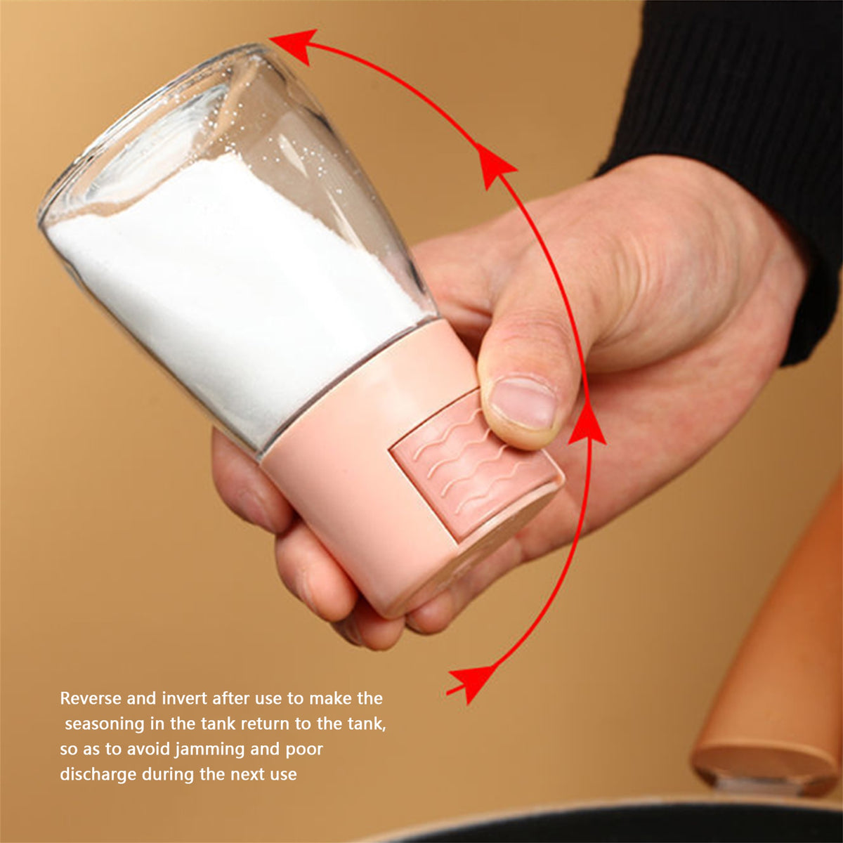 Someone holding a Measurable Mini Salt Control Bottle with a top press button
