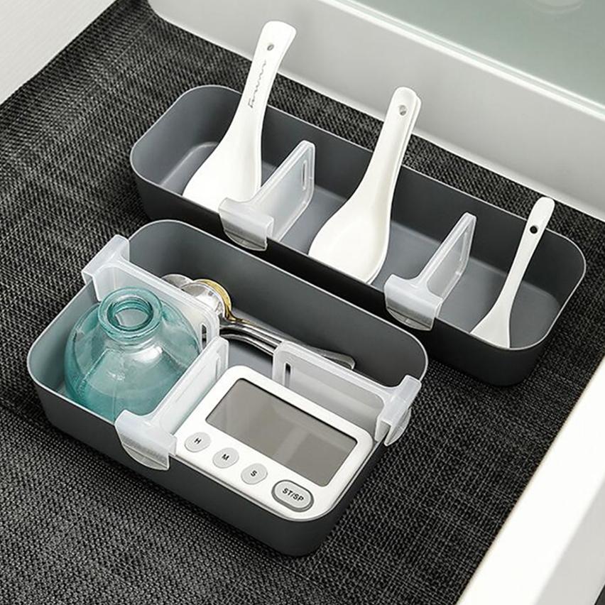  spoon and various utensils arranged in an organized manner with the use of partition clips