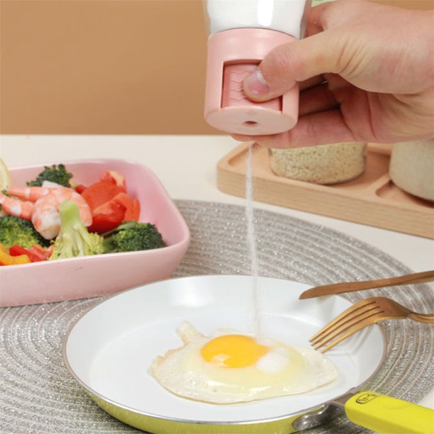 Someone using the Measurable Mini Salt Control Bottle