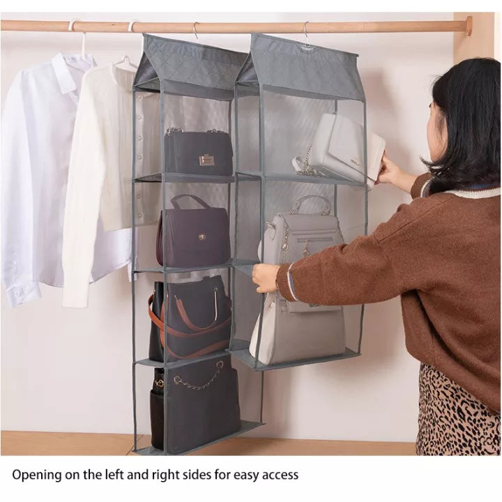 A person putting handbags on a multi layer hanging handbag wardrobe organizer