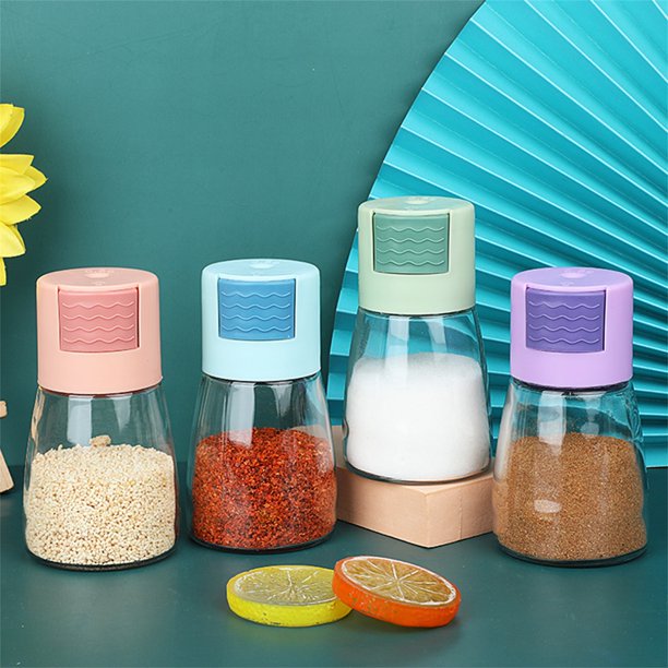 A group of Measurable Mini Salt Control Bottles with Top Press Buttons with different  color