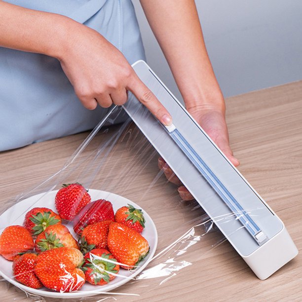A person using a Wall Mount Instant Plastic Wrap Dispenser with Slide Cutter