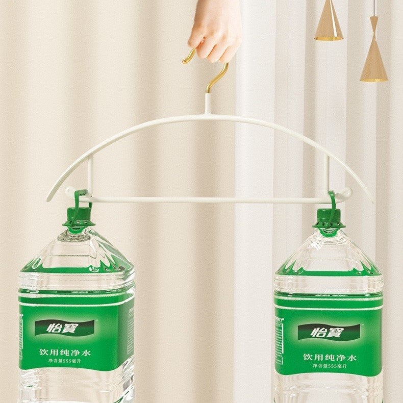 A hand holding A Traceless Clothes Hanger 