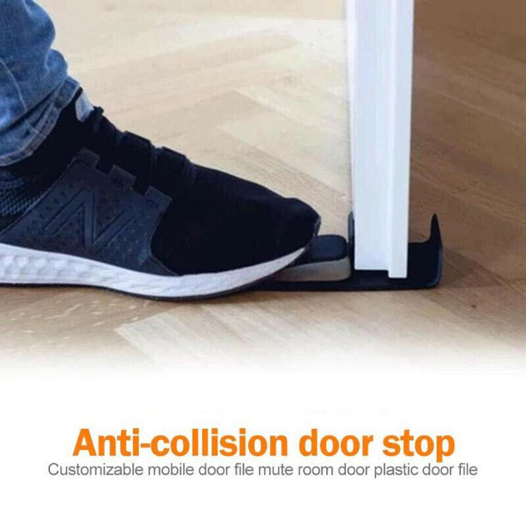 Innovative Door Stopper installed on a door being pressed by a person using his leg 