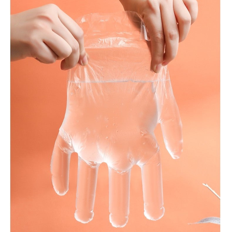 Someone is holding Disposable Hand Gloves with a Wall Mount Clip Organizer