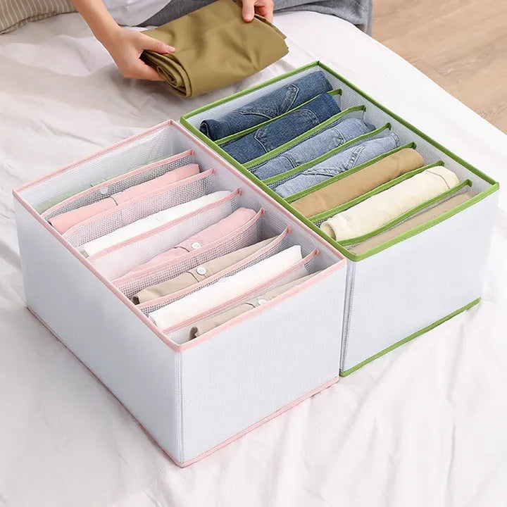 Person folding clothes and keeping in Cloth Organizer Wardrobe Storage Box