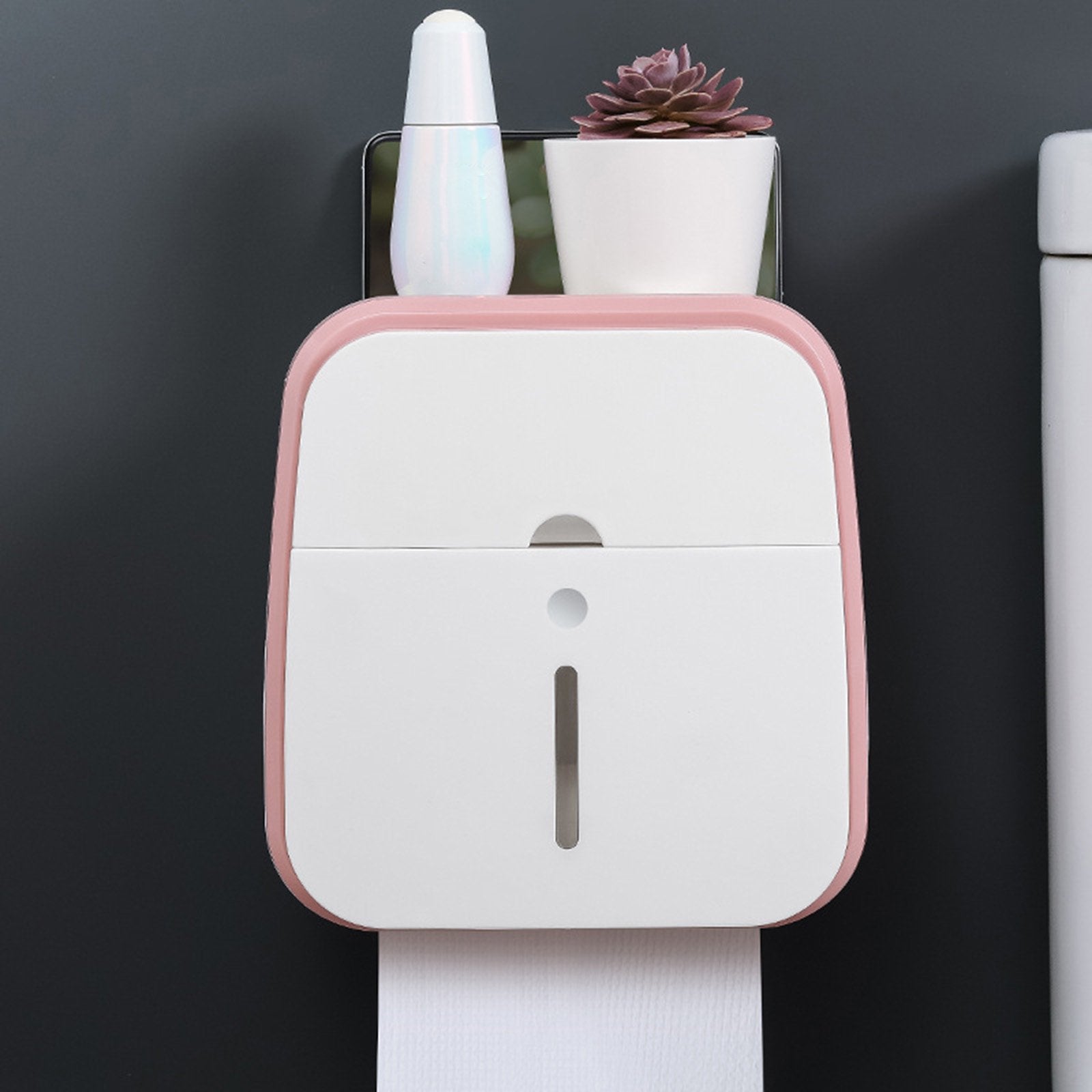 A toilet paper holder within easy reach